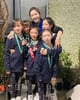 Coach Lia Zhang with Swimmers
